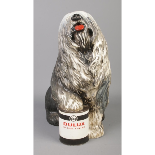 34 - A large Beswick Dulux advertising figure of an old English sheep dog with paw raised on a tin of pai... 