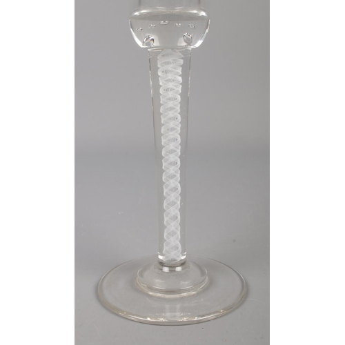 41 - An early to mid 20th century air twist wine glass. Having ten strand air twist and bubble inclusions... 