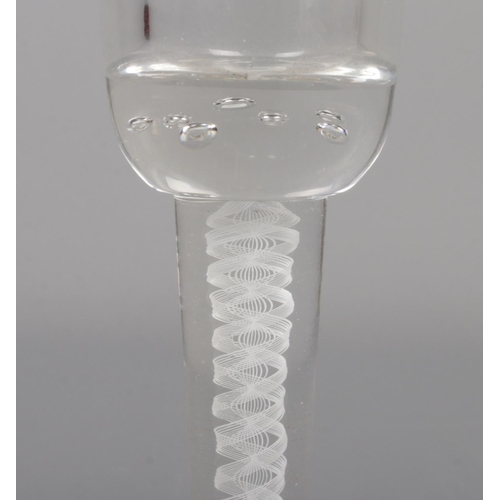 41 - An early to mid 20th century air twist wine glass. Having ten strand air twist and bubble inclusions... 