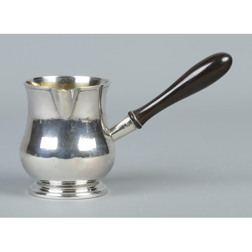 45 - A George III silver brandy pan with turned ebonised handle. Assayed London 1807. Height 8cm. 144g.