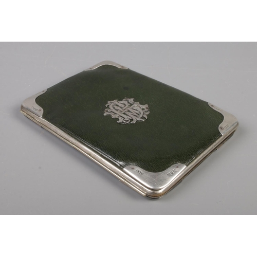 52 - A Victorian leather purse with silver mounts. Assayed Birmingham 1876 by Henry Williamson Ltd. 14cm ... 
