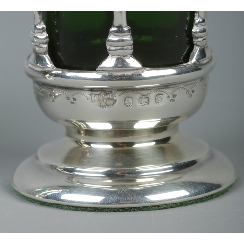 55 - A pair of Edwardian pierced silver vases with green glass liners. Weighted bases. Assayed Birmingham... 