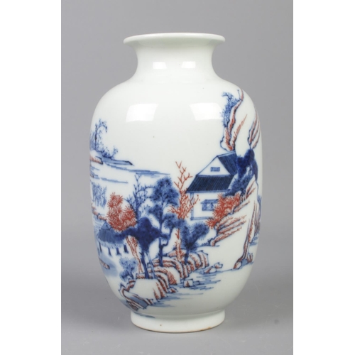 6 - A Chinese baluster shaped vase decorated with landscape scenes. Bearing spurious six character Kangx... 