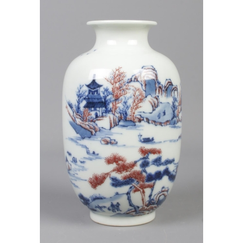6 - A Chinese baluster shaped vase decorated with landscape scenes. Bearing spurious six character Kangx... 