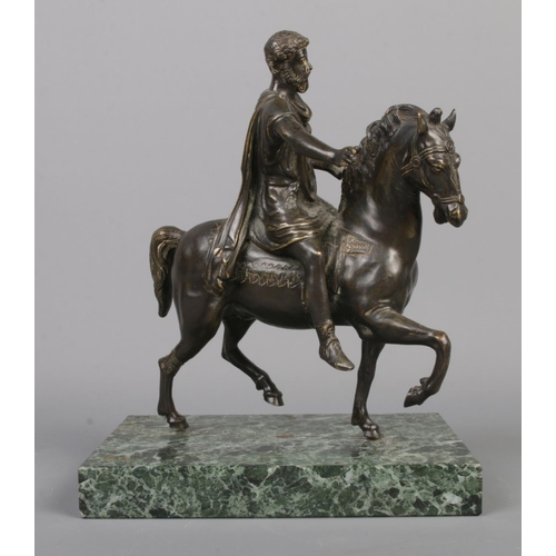 66 - An early 20th century French bronze sculpture, raised on verde marble plinth. Depicting an ancient G... 