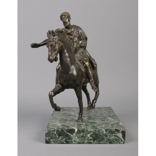 66 - An early 20th century French bronze sculpture, raised on verde marble plinth. Depicting an ancient G... 