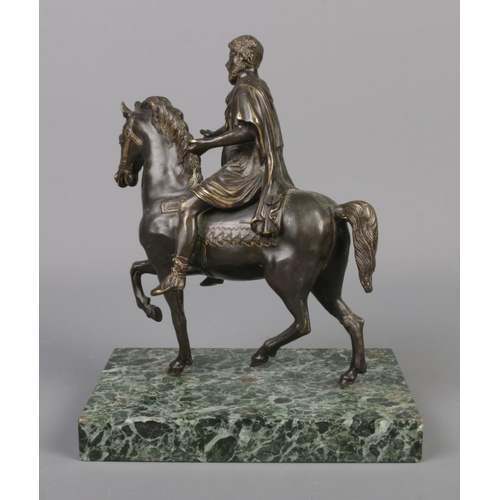 66 - An early 20th century French bronze sculpture, raised on verde marble plinth. Depicting an ancient G... 