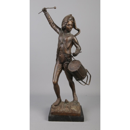 67 - After Leon Fagal, a large bronze figure of a drummer boy raised on square marble base. Height 48.5cm... 