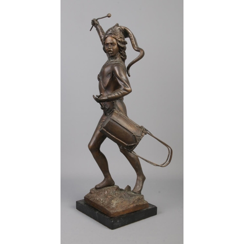 67 - After Leon Fagal, a large bronze figure of a drummer boy raised on square marble base. Height 48.5cm... 