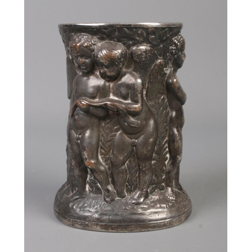 68 - A late 19th/early 20th century white metal brush pot. Decorated in relief with cherubs. Stamped Dini... 