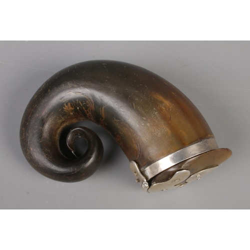 71 - An early 19th century Scottish horn snuff mull with hinged cover and white metal mounts. 10cm x 8cm.