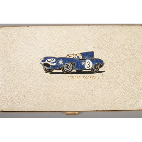 75 - A vintage cigarette case embossed with 1957 Le Mans winning No.3 D-type Jaguar and Ecurie Ecosse in ... 