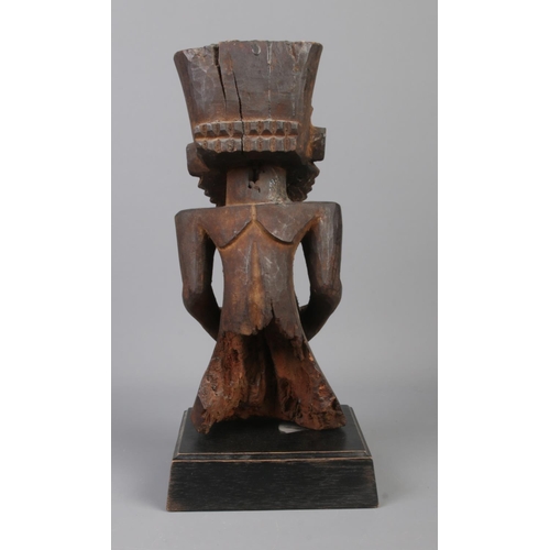 76 - An early to mid 20th century wooden ancestor figure raised on wooden plinth. Probably of the Hemba t... 