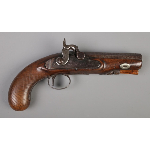 80 - A 19th century percussion cap pistol. Having walnut grip and damascus 11.5cm octagonal barrel. Stamp... 