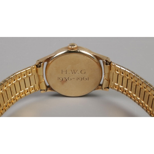 89 - A gents 9ct gold Longines manual wristwatch on stainless steel bracelet strap. Having baton and Arab... 