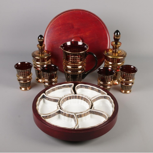 266 - A collection of decorative drinking glassware along with a mahogany 'Lazy Susan' with fitted ceramic... 