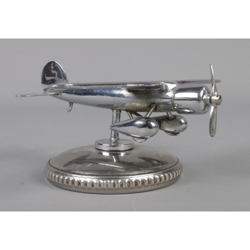 197 - A chromed 'Westwood Patents' plane car mascot/fuel cap, with rotating propellor. Wingspan of plane 1... 