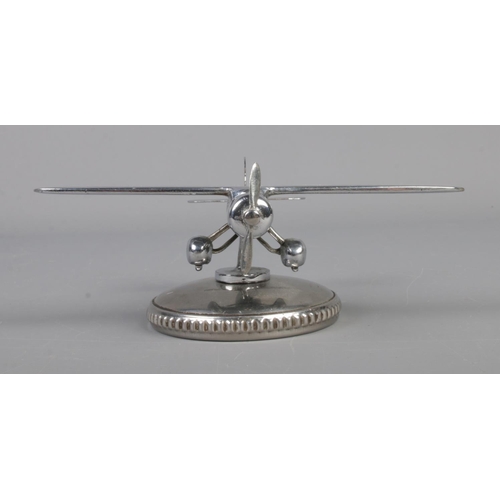 197 - A chromed 'Westwood Patents' plane car mascot/fuel cap, with rotating propellor. Wingspan of plane 1... 