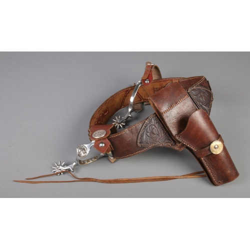 205 - A leather cartridge belt with cartridges, together with a pair of spurs.