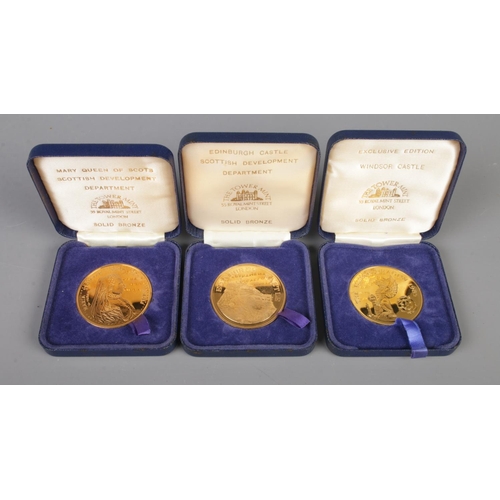 207 - The Tower Mint; Three solid bronze medallions depicting Windsor Castle, Edinburgh Castle and Mary Qu... 