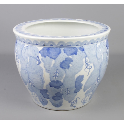 229 - A large blue and white jardiniere. Height 28.5cm, Diameter 35cm.