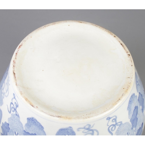 229 - A large blue and white jardiniere. Height 28.5cm, Diameter 35cm.