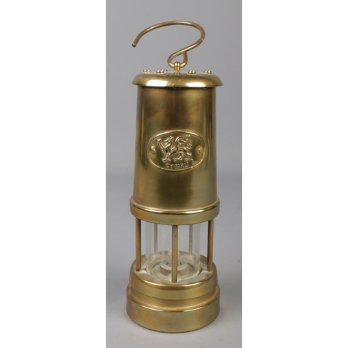 231 - A brass miners safety lamp bearing Welsh Dragon insignia, Cymru.