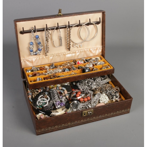 261 - A cantilever jewellery box with contents of costume jewellery including bracelets, rings, earrings, ... 