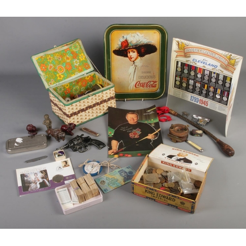 265 - A quantity of collectables. Includes coins, Coca-Cola tray, composite figures, pocket knives, bobbin... 