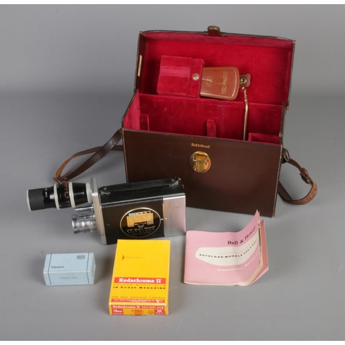 273 - A Bell & Howell 16mm Cine Camera in original leather carry case with accessories such as manual and ... 