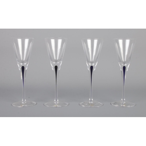 286 - Orrefors - A set of four Intermezzo liqueur glasses, with blue stem. 15cm tall.