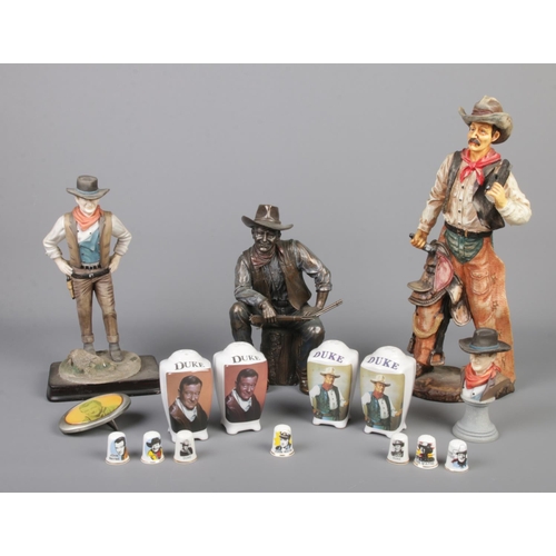 314 - A quantity of ceramics and collectables depicting John Wayne. To include salt and pepper pots, belt ... 