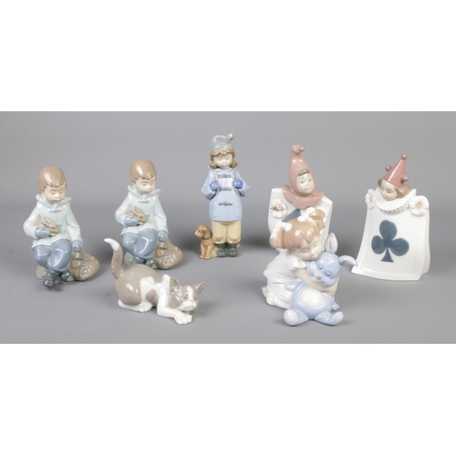 315 - Six Nao by Lladro ceramic figures, together with a Lladro ceramic cat.