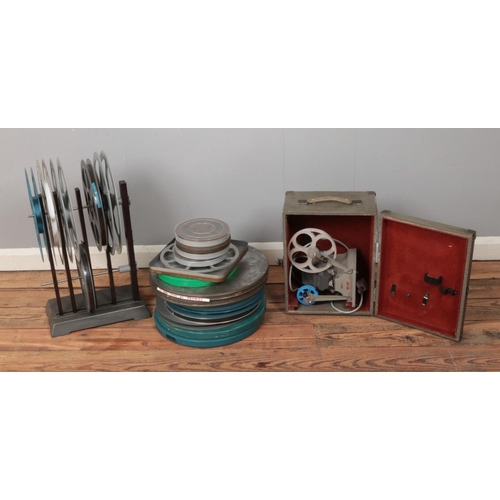 324 - A collection of assorted tape reels along with Minette View Editor Eight and reel stand. Includes An... 