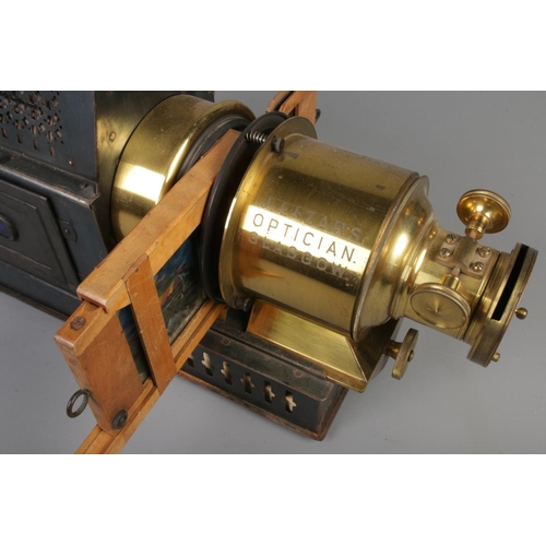 397 - An unmarked magic lantern projector converted to electric marked J.Lizars Opticians Glasgow to lens.... 