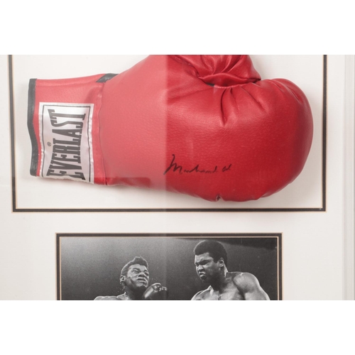 454 - A Muhammed Ali signed boxing glove in presentation case. Approx. case dimensions 51cm x 57cm x 19cm.