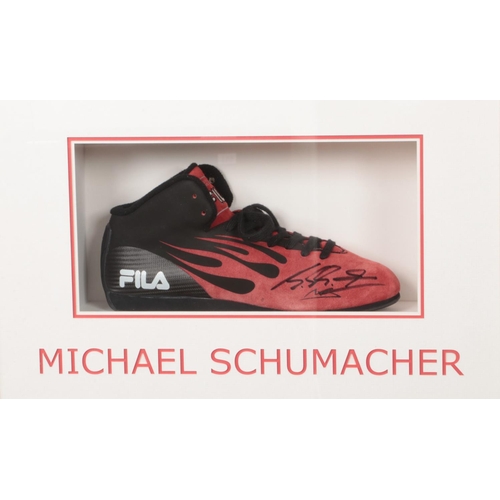 456 - A signed Michael Schumacher right Fila shoe mounted in display case along with photograph. Approx. c... 