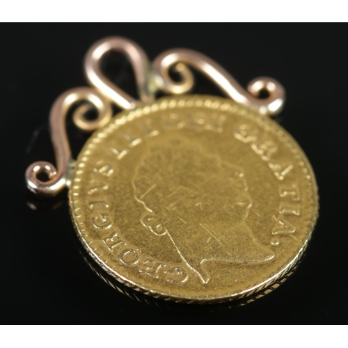 478 - A George III, Third Guinea gold coin, dated 1800. With yellow metal mount. 3.25g gross weight.