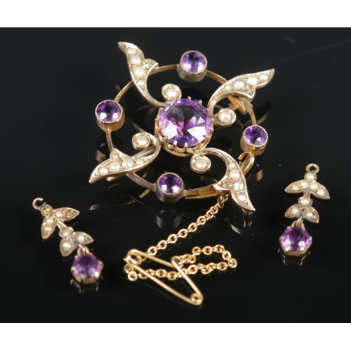 484 - A 9ct gold amethyst & seed pearl jewellery suite. Comprising of brooch and two earrings. 6.02g gross... 