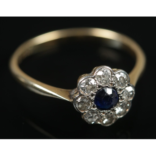 488 - An 18ct gold sapphire & diamond floriform ring. Size N, 1.89g.