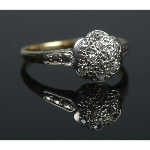 516 - A vintage 18ct gold and platinum diamond cluster ring. Hallmarks for Birmingham 1978. Size P 1/2. 3.... 