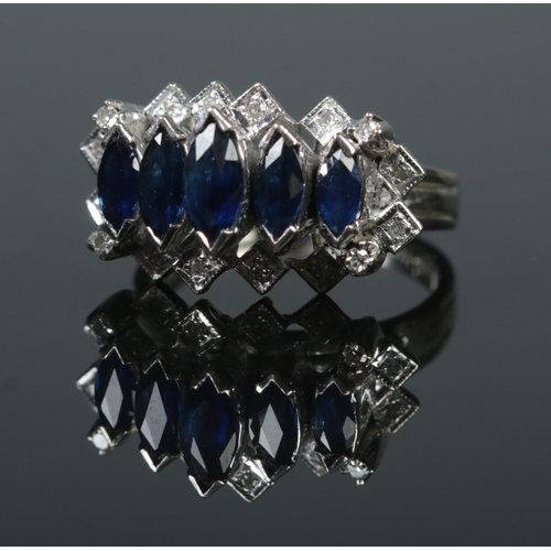 520 - A 14ct white gold, sapphire and diamond cocktail ring. Size N. 7.24g.