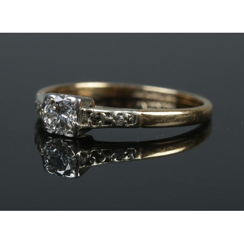 521 - An Art Deco 18ct gold and platinum diamond solitaire ring. Size L. 1.98g. Approximately 0.25ct diamo... 