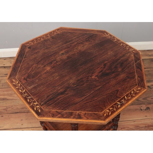 563 - A Victorian rosewood window table with inlaid and crossbanded decoration.