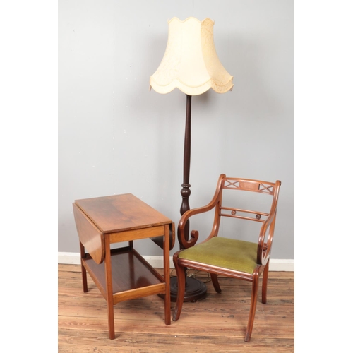 582 - Two pieces of furniture and a standard lamp. Includes a walnut tea trolley with castors and a Sherat... 