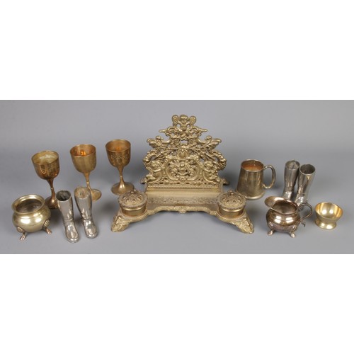 293 - A quantity of assorted metalware including goblets, novelty boots, inkwell, etc.