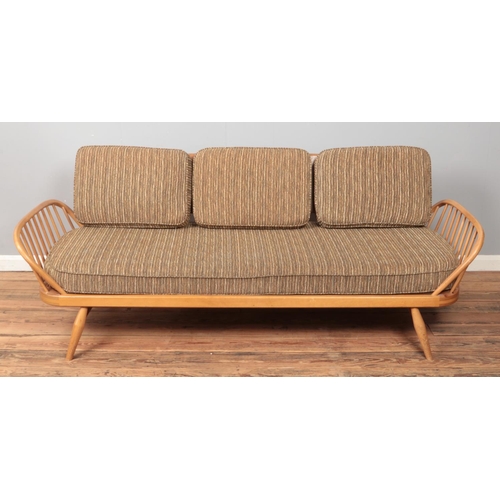 584 - Lucian Ercolani for Ercol, a vintage sofa/day bed with 'Surfboard' back. Length 210cm.