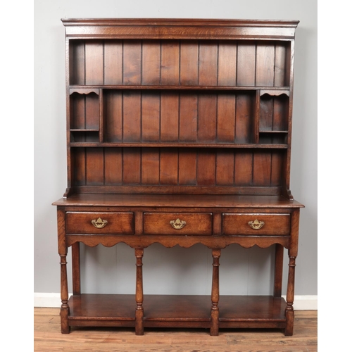 585 - A Titchmarsh & Goodwin oak dresser.