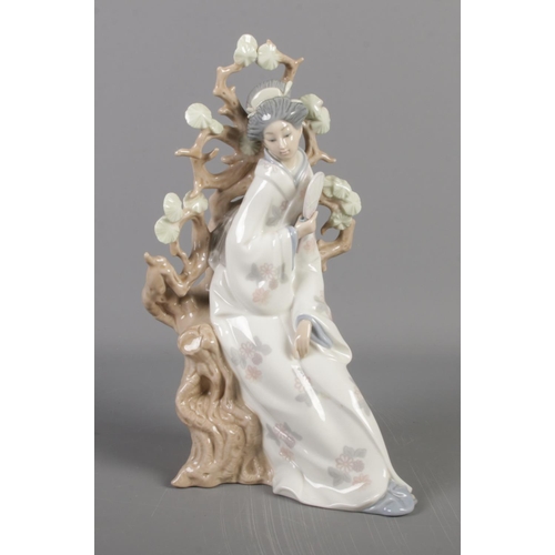 235 - Lladro figure of an oriental lady fanning herself by a tree