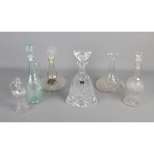 254 - A Royal Doulton crystal glass decanter along with cut glass and other glass decanters.